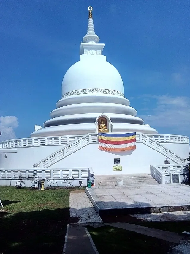 The white dome, terrace and steps of the Japanese Peace Pagoda at Rumassala