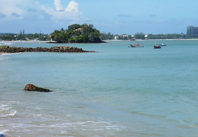 Weligama Bay with fishing boats and Taprobane Island offshore
